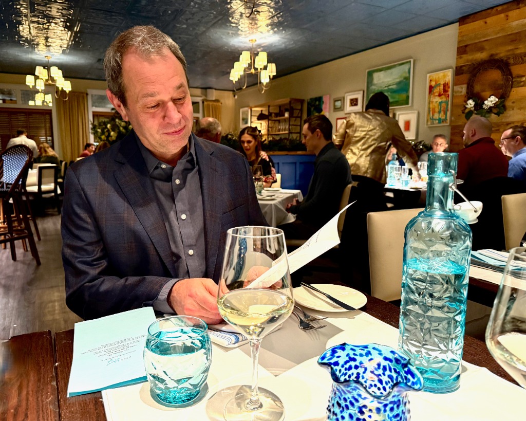 A customer reviewing a menu at a restaurant